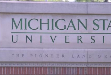 密西根州立大学推迟大学项目并削减员工薪水